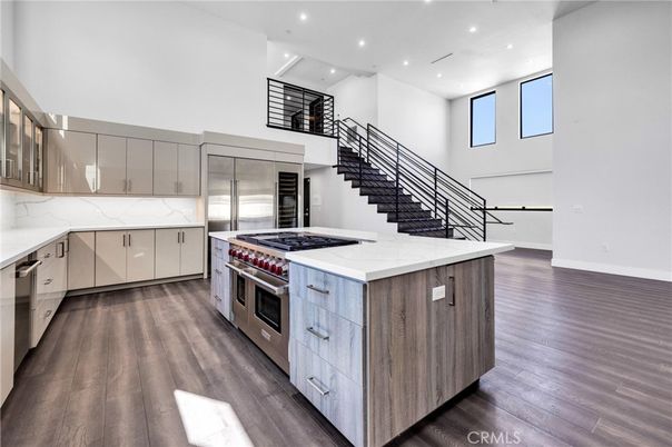Interior, Kitchen, Marble Walls, Recessed Lighting, Stainless Steel Appliances, Wood Texture Flooring