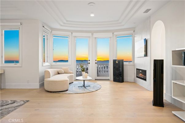 Fireplace, Interior, Living room, Recessed Lighting, Water, Wood Texture Flooring