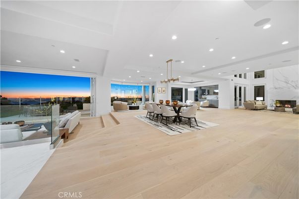 Dining room, Fireplace, Interior, Living room, Pendant Lights, Recessed Lighting, Water, Wood Texture Flooring