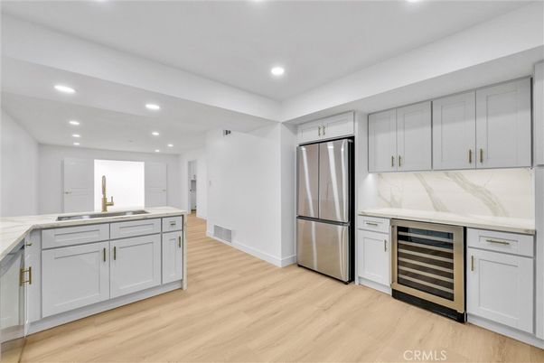 Interior, Kitchen, Marble Walls, Recessed Lighting, Stainless Steel Appliances, Wood Texture Flooring