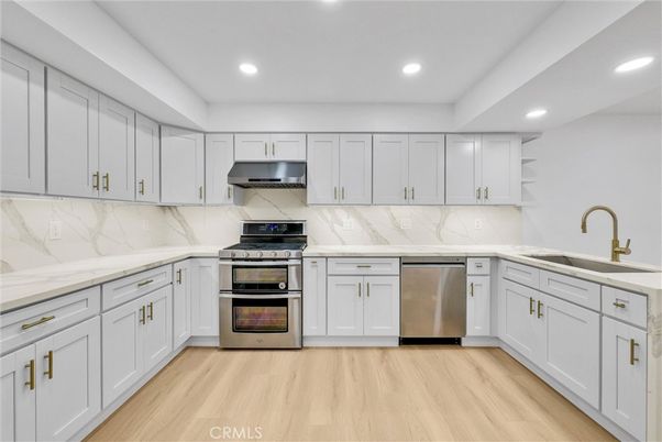 Interior, Kitchen, Marble Walls, Recessed Lighting, Stainless Steel Appliances, Wood Texture Flooring