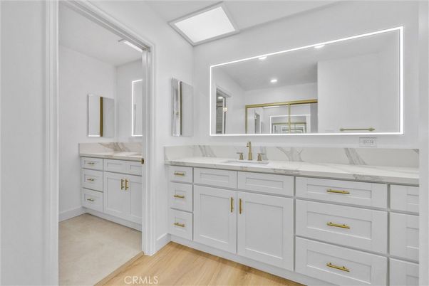 Bathroom, Dual Sink Vanities, Interior, Recessed Lighting, Wood Texture Flooring