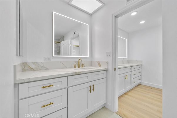 Bathroom, Dual Sink Vanities, Interior, Recessed Lighting, Wood Texture Flooring