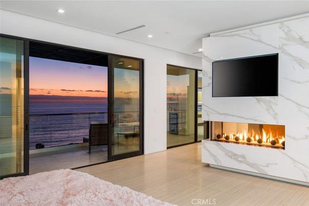 Fireplace, Interior, Marble Walls, Recessed Lighting, Water, Wood Texture Flooring