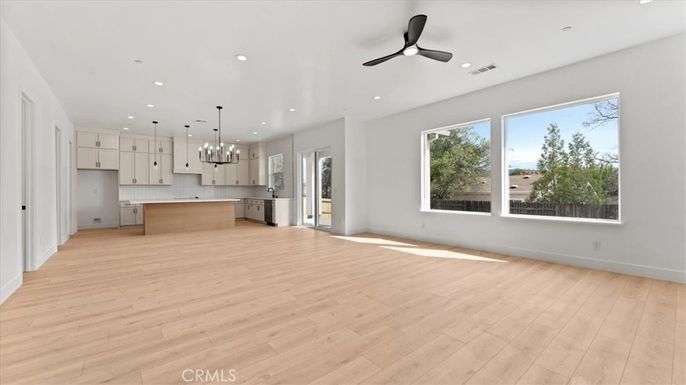 Empty room, Interior, Kitchen, Pendant Lights, Recessed Lighting, Stainless Steel Appliances, Wood Texture Flooring