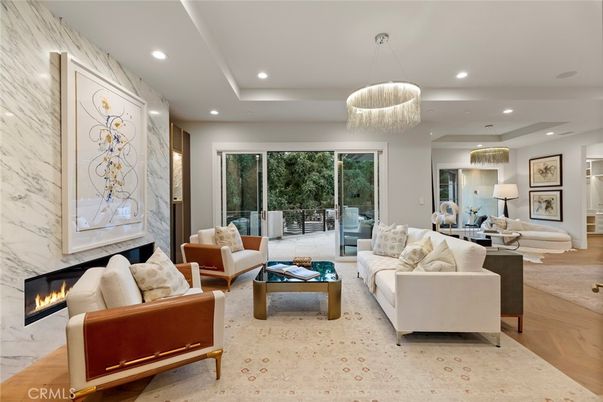 Fireplace, Interior, Living room, Marble Walls, Pendant Lights, Recessed Lighting, Wood Texture Flooring