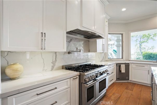 Interior, Kitchen, Marble Walls, Recessed Lighting, Stainless Steel Appliances, Wood Texture Flooring