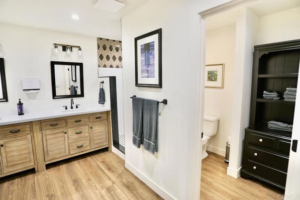 Bathroom, Dual Sink Vanities, Interior, Recessed Lighting, Wood Texture Flooring