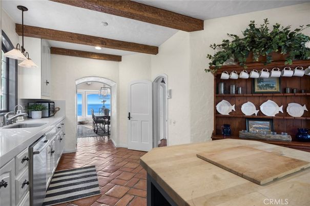Dining room, Fireplace, Interior, Pendant Lights, Recessed Lighting, Water, Wooden Beams