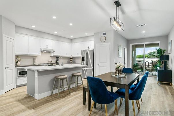 Dining room, Interior, Kitchen, Pendant Lights, Recessed Lighting, Stainless Steel Appliances, Wood Texture Flooring