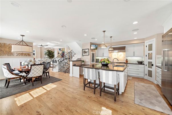 Dining room, Interior, Kitchen, Pendant Lights, Recessed Lighting, Stainless Steel Appliances, Wood Texture Flooring
