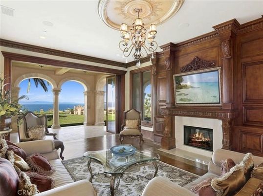 Chandelier, Fireplace, Interior, Living room, Recessed Lighting, Water, Wooden Walls