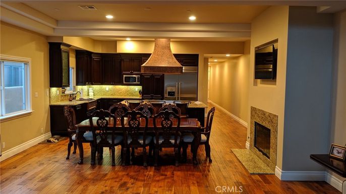 Dining room, Fireplace, Interior, Kitchen, Recessed Lighting, Wood Texture Flooring