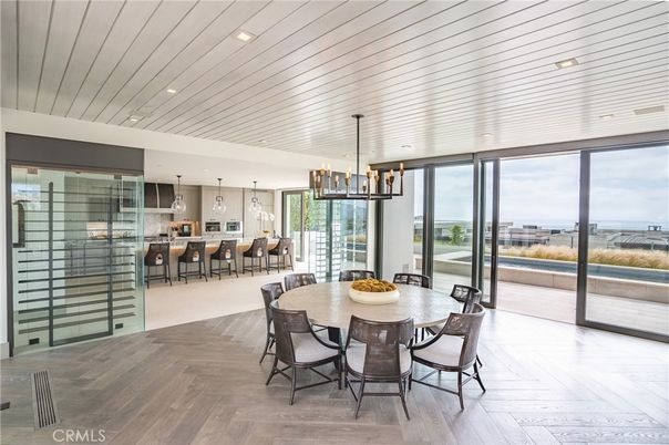 Dining room, Interior, Kitchen, Pendant Lights, Recessed Lighting, Stainless Steel Appliances, Water, Wood Texture Flooring