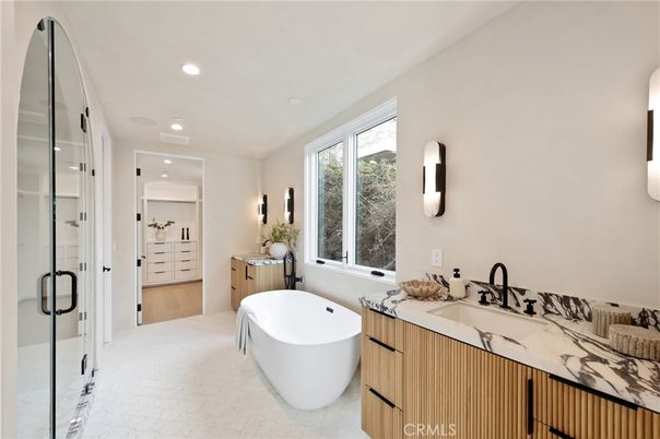 Bathroom, Dual Sink Vanities, Free Standing Baths, Glass Shower, Interior, Recessed Lighting, Wood Texture Flooring
