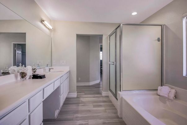 Bathroom, Dual Sink Vanities, Glass Shower, Interior, Recessed Lighting, Wood Texture Flooring