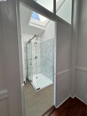 Bathroom, Glass Shower, Interior, Marble Walls, Wood Texture Flooring