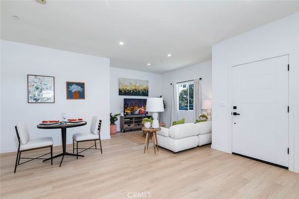 Dining room, Fireplace, Interior, Living room, Recessed Lighting, Wood Texture Flooring