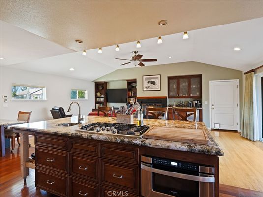 Dining room, Fireplace, Interior, Kitchen, Living room, Recessed Lighting, Wood Texture Flooring