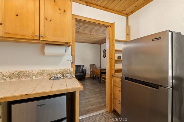 Interior, Kitchen, Tile Countertops, Wooden Ceilings, Wood Texture Flooring