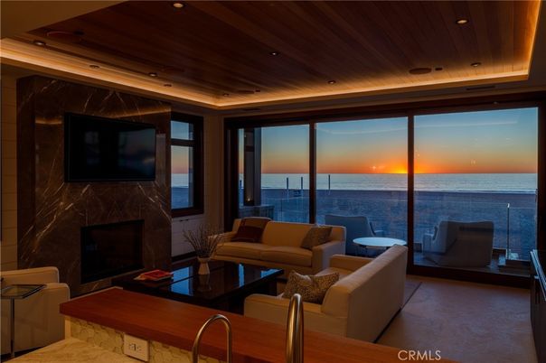 Fireplace, Interior, Living room, Marble Walls, Recessed Lighting, Water, Wooden Ceilings