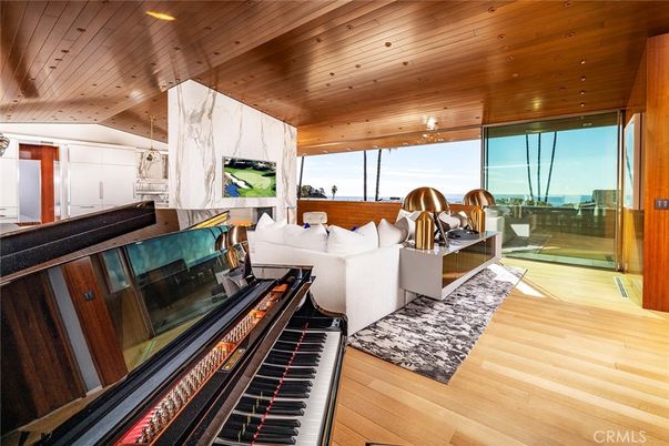 Fireplace, Interior, Living room, Marble Walls, Piano, Recessed Lighting, Water, Wooden Ceilings, Wood Texture Flooring