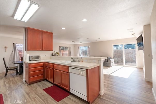 Interior, Kitchen, Recessed Lighting, Tile Countertops, Wood Texture Flooring