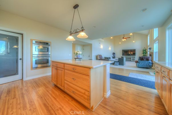 Fireplace, Interior, Kitchen, Living room, Pendant Lights, Recessed Lighting, Stainless Steel Appliances, Wood Texture Flooring