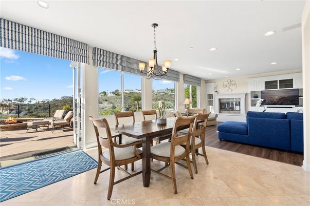 Chandelier, Dining room, Fireplace, Interior, Living room, Pendant Lights, Recessed Lighting, Wood Texture Flooring