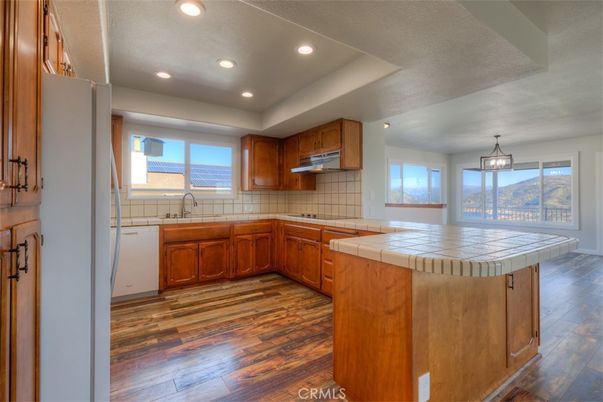 Interior, Kitchen, Pendant Lights, Recessed Lighting, Tile Countertops, Wood Texture Flooring