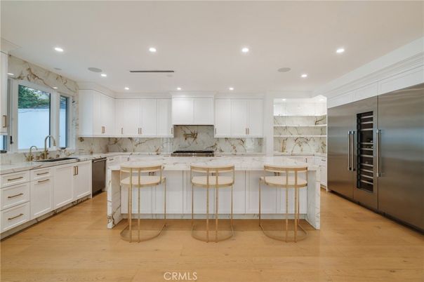 Interior, Kitchen, Marble Walls, Recessed Lighting, Stainless Steel Appliances, Wood Texture Flooring