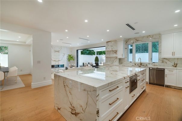 Interior, Kitchen, Marble Walls, Recessed Lighting, Stainless Steel Appliances, Wood Texture Flooring