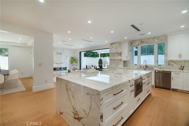 Interior, Kitchen, Marble Walls, Recessed Lighting, Stainless Steel Appliances, Wood Texture Flooring