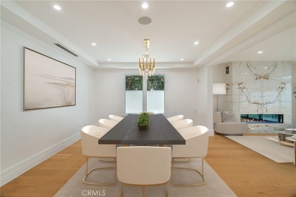 Dining room, Fireplace, Interior, Living room, Marble Walls, Pendant Lights, Recessed Lighting, Wood Texture Flooring