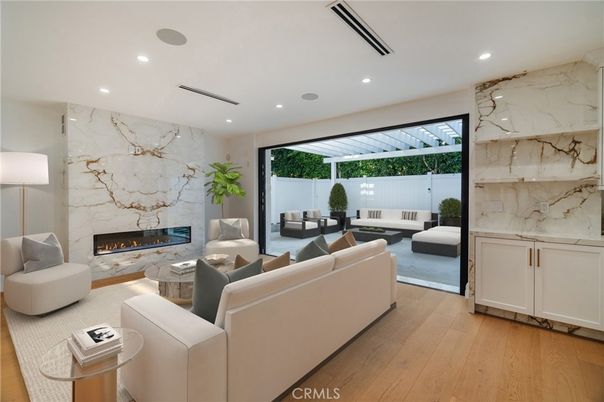 Fireplace, Interior, Living room, Marble Walls, Recessed Lighting, Wood Texture Flooring