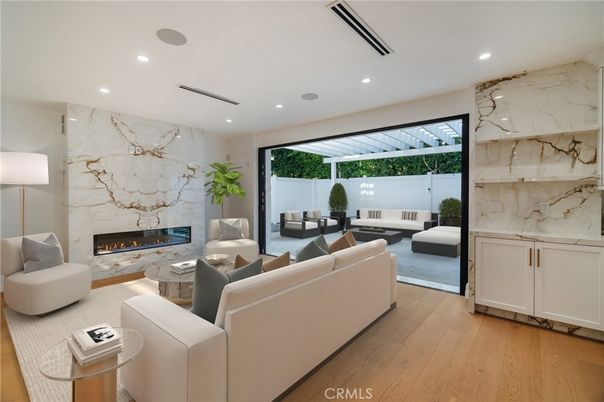 Fireplace, Interior, Living room, Marble Walls, Recessed Lighting, Wood Texture Flooring