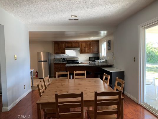 Dining room, Interior, Kitchen, Recessed Lighting, Stainless Steel Appliances, Wood Texture Flooring