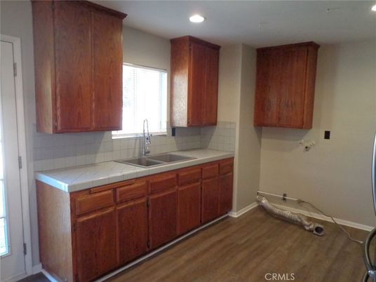Interior, Kitchen, Recessed Lighting, Tile Countertops, Wood Texture Flooring