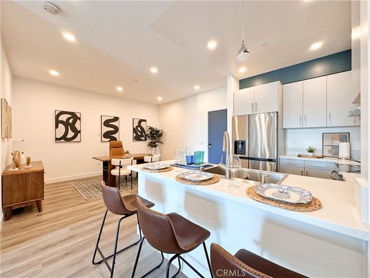 Dining room, Interior, Kitchen, Pendant Lights, Recessed Lighting, Stainless Steel Appliances, Wood Texture Flooring