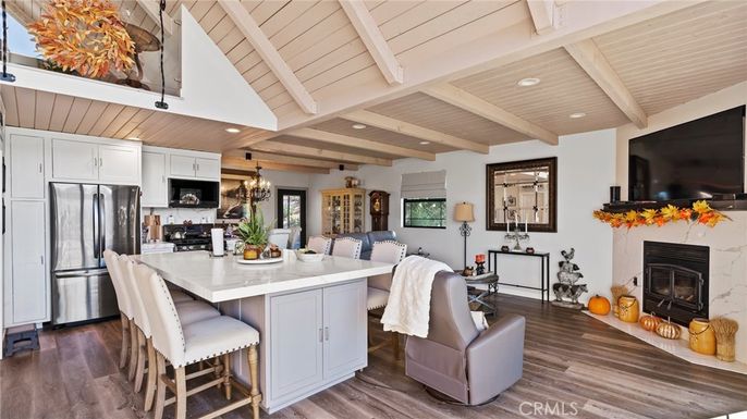 Chandelier, Dining room, Fireplace, Interior, Kitchen, Living room, Pendant Lights, Recessed Lighting, Stainless Steel Appliances, Wooden Beams, Wooden Ceilings, Wood Texture Flooring