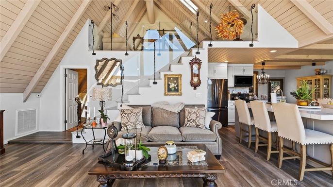 Chandelier, Dining room, Interior, Kitchen, Living room, Pendant Lights, Recessed Lighting, Stainless Steel Appliances, Wooden Beams, Wooden Ceilings, Wood Texture Flooring