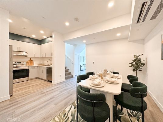 Dining room, Interior, Kitchen, Recessed Lighting, Stainless Steel Appliances, Wood Texture Flooring