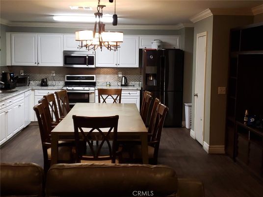 Chandelier, Dining room, Interior, Kitchen, Stainless Steel Appliances, Wood Texture Flooring