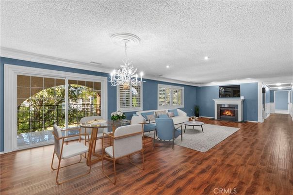 Chandelier, Dining room, Fireplace, Interior, Living room, Recessed Lighting, Wood Texture Flooring