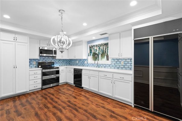 Chandelier, Interior, Kitchen, Recessed Lighting, Stainless Steel Appliances, Wood Texture Flooring