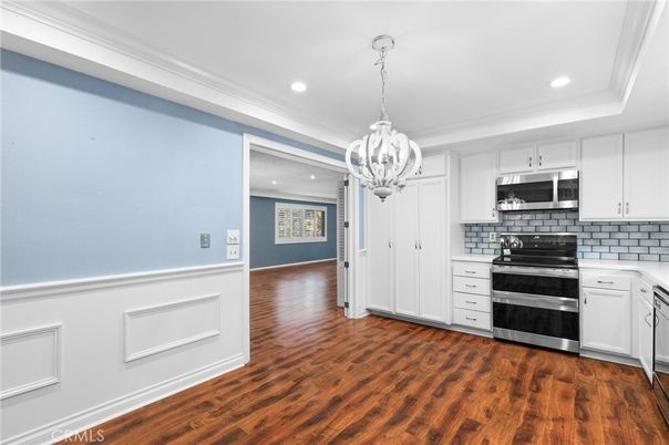 Chandelier, Interior, Kitchen, Recessed Lighting, Stainless Steel Appliances, Wood Texture Flooring