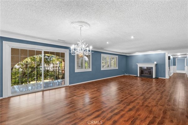 Chandelier, Empty room, Fireplace, Interior, Recessed Lighting, Wood Texture Flooring