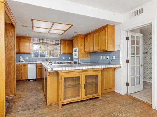 Interior, Kitchen, Recessed Lighting, Tile Countertops, Wood Texture Flooring