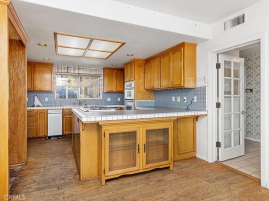 Interior, Kitchen, Recessed Lighting, Tile Countertops, Wood Texture Flooring