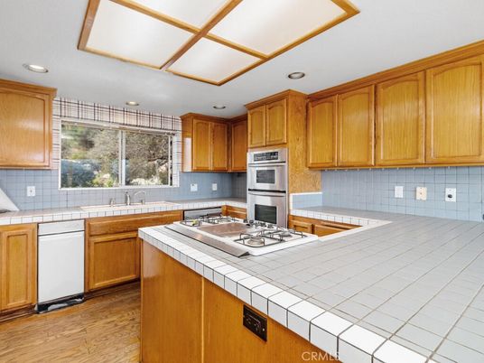 Interior, Kitchen, Recessed Lighting, Tile Countertops, Wood Texture Flooring
